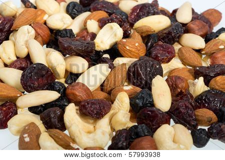 mixed nuts and dried fruits isolated on white background