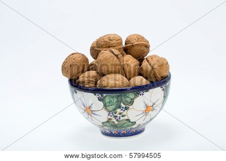 ripe walnuts heap isolated on white background