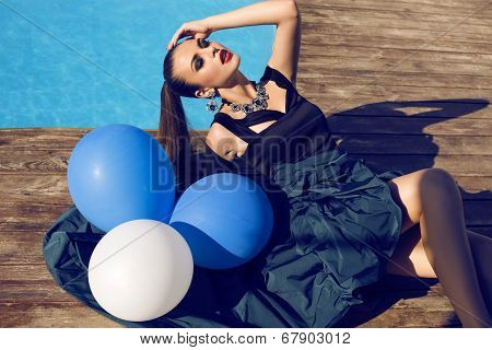 Fashion Model In Luxury Dress Posing With Balloons