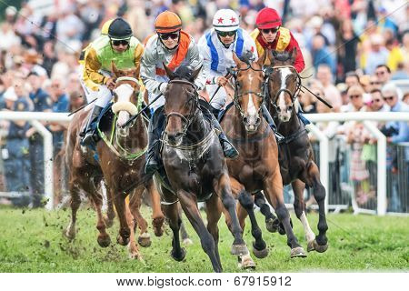 Jockeys Into Last Curve At The Nationaldags Galoppen With The Crowd Behind