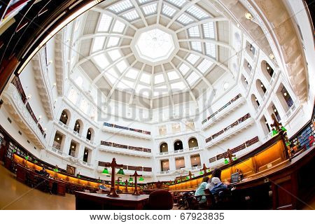 MELBOURNE - July 3, 2014: La Trobe reading room at the State Library of Victoria in Melbourne. The library holds over 2 million books.  It is the central library of the state of Victoria, Australia.