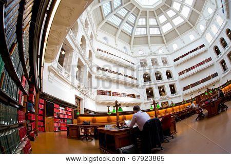 MELBOURNE - July 3, 2014: La Trobe reading room at the State Library of Victoria in Melbourne. The library holds over 2 million books.  It is the central library of the state of Victoria, Australia.