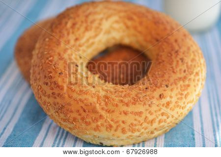 Two Turkish bagels, simits on the table. Selective focus on the front edge of the simit