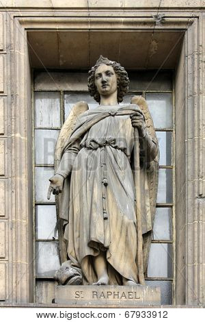 PARIS,FRANCE - NOV 09,2012: Archangel Raphael, architectural details of Eglise de la Madeleine. Madeleine Church was designed in its present form as a temple to the glory of Napoleon's army.