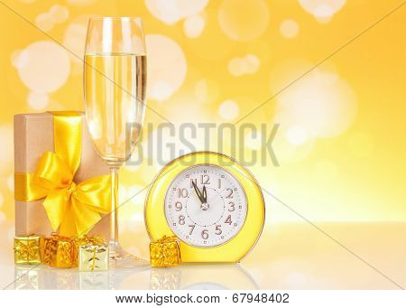 Champagne, gift clock showing time about midnight
