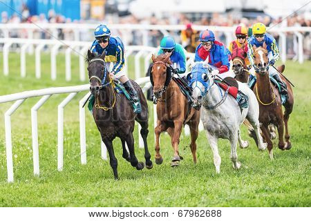Group Of Jockeys Out Of The Fourth Curve At The Nationaldags Galoppen In Gardet
