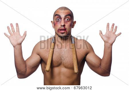 Man with nunchucks isolated on white