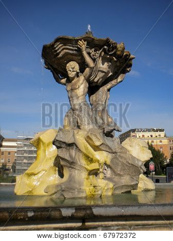 travertin male figures carrying a huge dish with water, antique fountain in rome, italy, europe