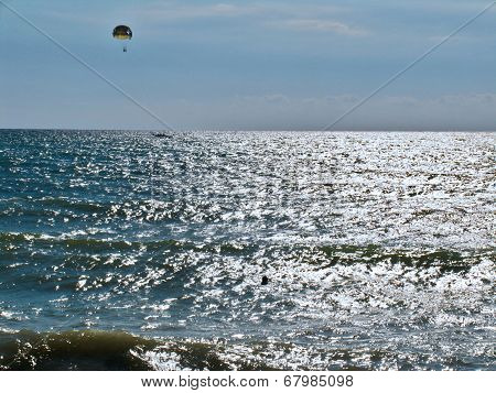 Parachutists over the sea