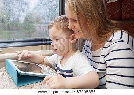 Mother and her young son on a train