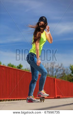 Summer Sport. Cool Girl Skater Riding Skateboard