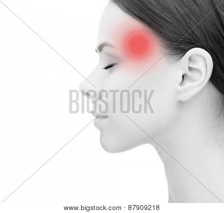 health, people and medicine concept - face of beautiful young woman suffering from headache