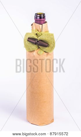 one bottle wrapped in paper with decorative bow