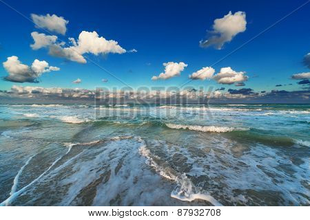 waves on the beach on a sunny day