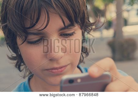 Boy With Smartphone On Street