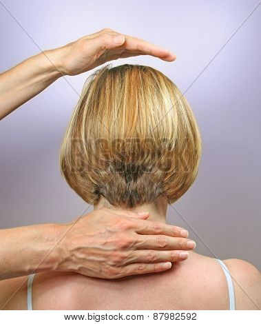 Demonstrating hand positions for channeling healing