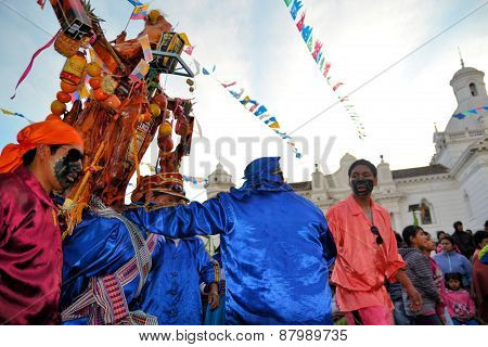 Latacunga, Ecuador 30 September, 2012: Participants take a break from parading pigs adorned with fruits, spirits, flags and guinea pigs at the La Fiesta de la Mama Negra traditional festival.