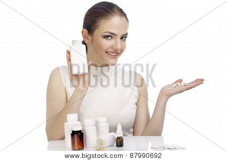 Beautiful Smiling Young Woman Showing A Pill Bottle