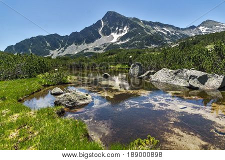 Landscape with Reflection of Sivrya peak in Banski lakes, Pirin Mountain, Bulgaria