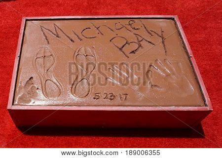 LOS ANGELES - MAY 23:  Michael Bay prints at the Michael Bay Hand And Footprint Ceremony at the TCL Chinese Theater IMAX on May 23, 2017 in Los Angeles, CA