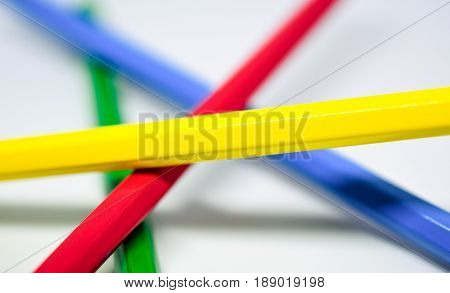 Close up of coloured pencils on white background