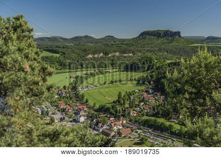 Big rocks near Bastei bridge in valley of river Elbe or Labe in spring sunny day