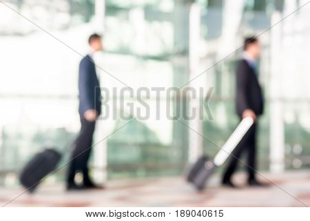 Blur businessmen with luggage at the airport for background