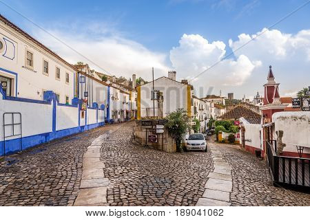OBIDOS,PORTUGAL - MAY 11,2017 - In the streets of the picturesque town of Obidos. The area of the town of Obidos is located on a hilltop encircled by a fortified wall.