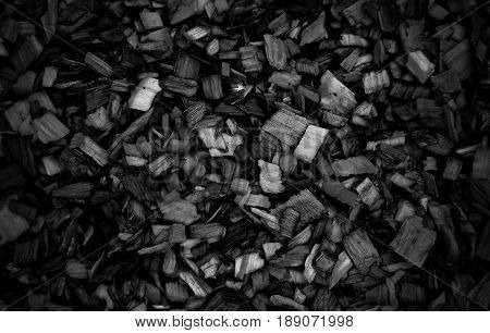 Dark Wooden chips for combustion in a biomass firing plant