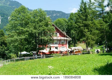 People Eating And Drinking At The Old Restaurant Degen In Ballenberg