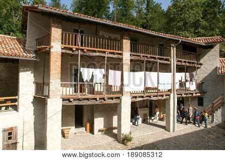 People Visiting On Walking An Old Farm House In Ballenberg
