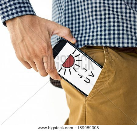 Hand holding digital device network graphic overlay from trouser pocket