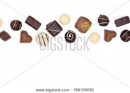 Top View Of Various Gourmet Chocolate Candies Isolated On White