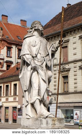 MARIBOR, SLOVENIA - APRIL 03: Saint Roch statue, Plague column at Main Square of the city of Maribor in Slovenia, Europe. Historical religious sculpture, April 03, 2016.