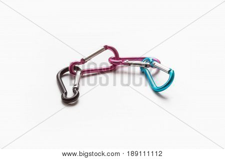 Colorful climbing carbiners isolated against white background