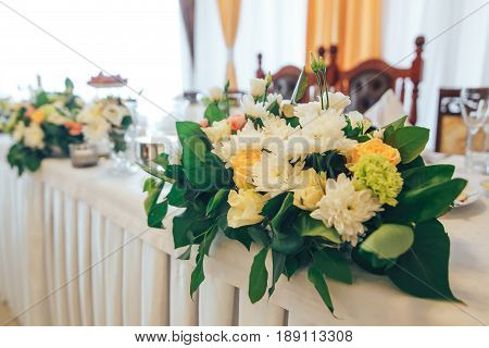 Beautiful wedding table setting with fresh flowers