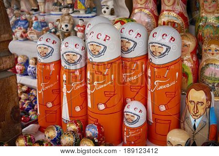 MOSCOW, MAY 26, 2017: Russian dolls matreshka at souvenir market shop. Traditional Russian handicraft hand made dolls with celebrities cartoon portraits first cosmonaut Uriy Gagarin, Vladimir Putin