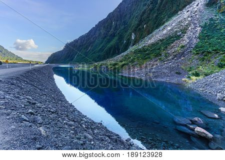 Road leading to entrance of Fox Glacier / Te Moeka o Tuawe Valley Walk is located in Westland Tai Poutini National Park on the West Coast of New Zealand's South Island