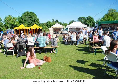 TENTERDEN, ENGLAND - MAY 21, 2017: People enjoying the Food and Drink Festival at Tenterden in Kent. The festival was held for the first time in 2017 and hopes to become an annual event.