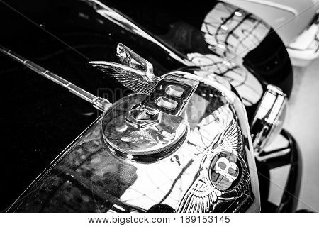 BERLIN - MAY 13 2017: Hood emblem of the luxury car Bentley. Black and white. Exhibition "Oldtimertage Berlin-Brandenburg".