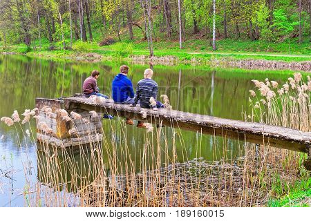 Vilnius, Lithuania - September 4 2014:  fishermen at the Pond in Traku Voke public park in Vilnius Lithuania.