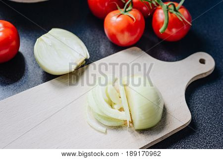 Chopped Onion On A Wooden Chopping Board