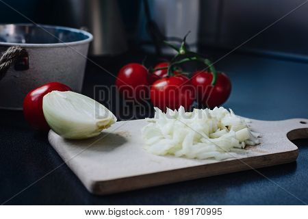 Chopped Onion On A Wooden Chopping Board