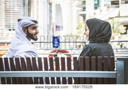 Arabic couple with traditional clothes dating outdoors
