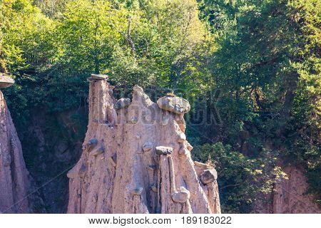 The concept of world tours. Renon's earth pillars at sunrise. Journey to the magic country Tirol