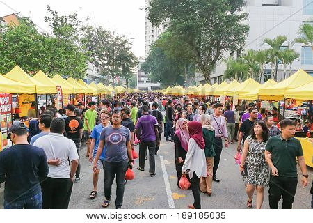 Kuala Lumpur, Malaysia, May 29, 2016: Muslim Shopper Buying Food From Street Vendor For Breaking Fas