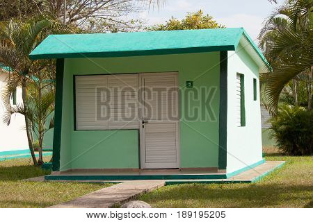 Colorful blue and green painted cabin in cuba
