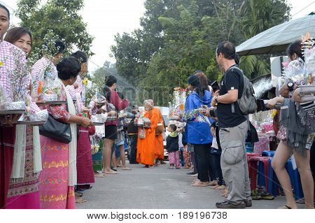 12 January 2017 : people offer food to the monks in the morning, mynmar style at Kanchanaburi