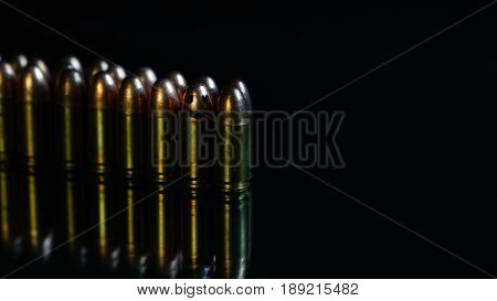 9mm bullets on the black mirror background