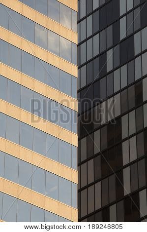 Facade glass windows of two building. Facade of two skyscrapers with lines in architectural perspective.